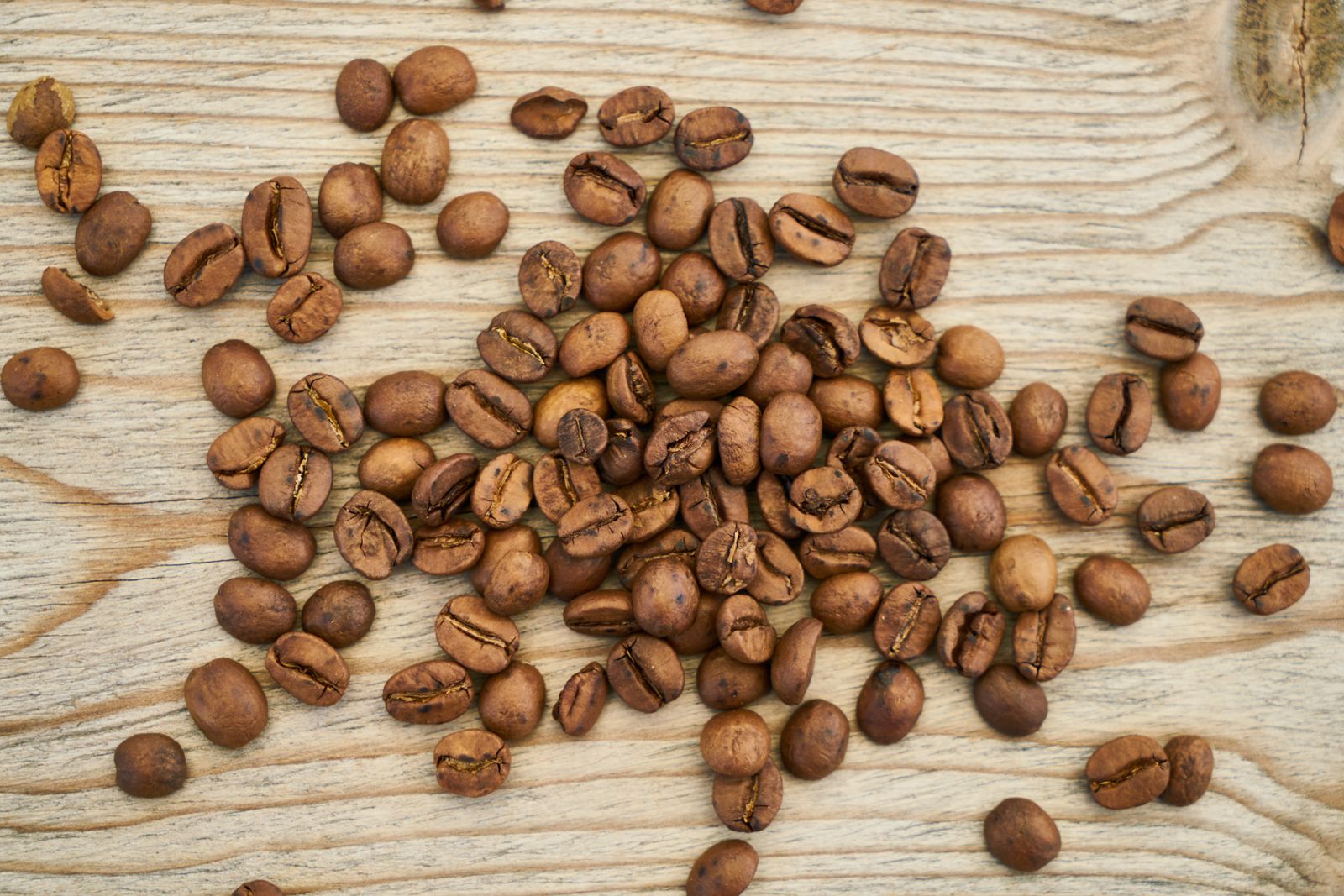 Roasted coffee beans seen in crisp natural light