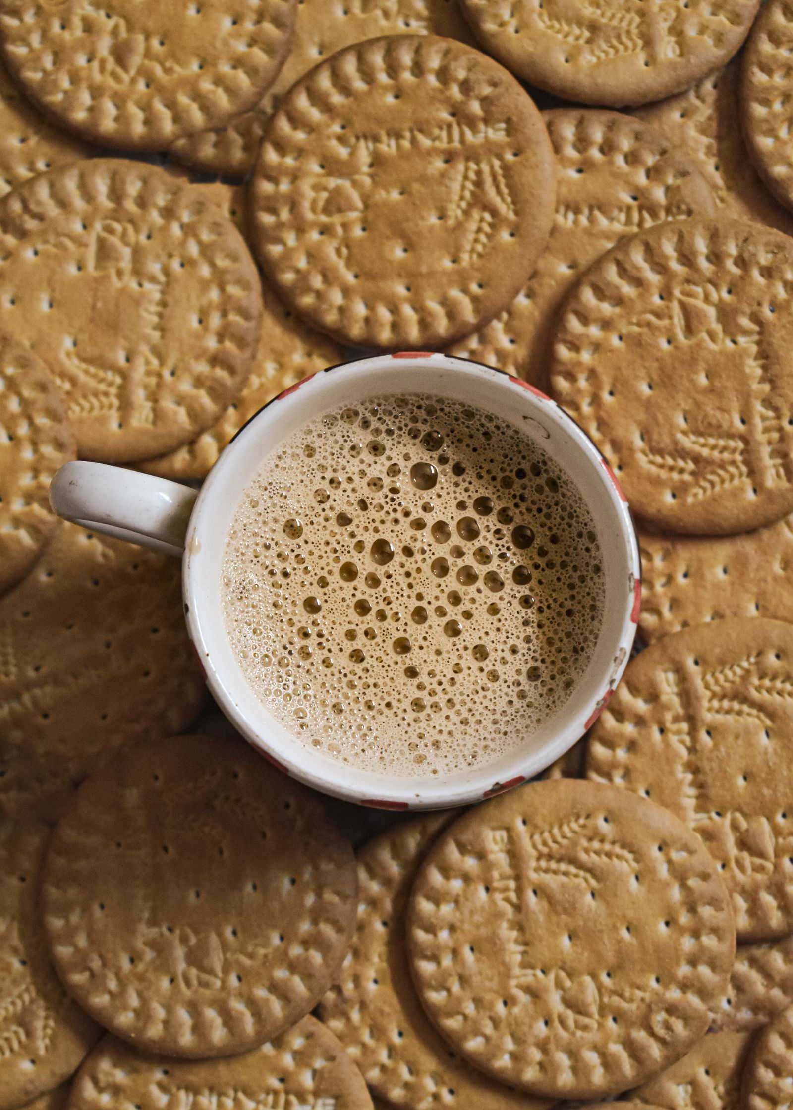 Coffee and biscuits arranged as a calm editorial still life
