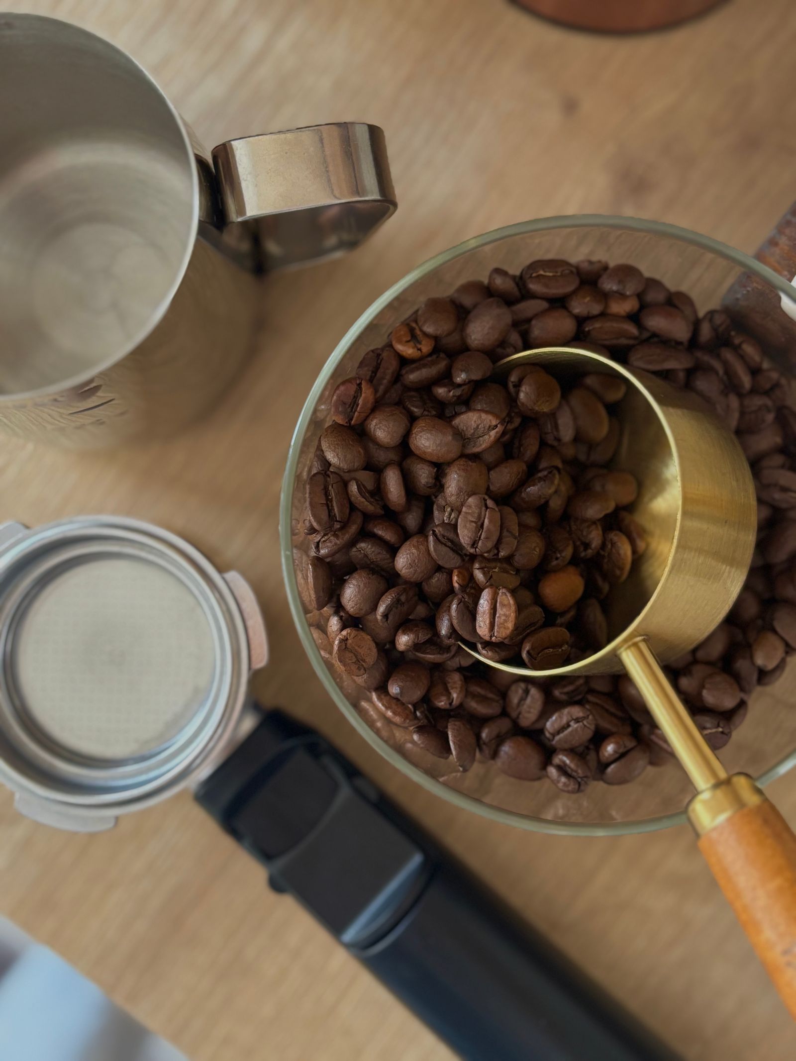 Coffee preparation tools arranged in warm natural light